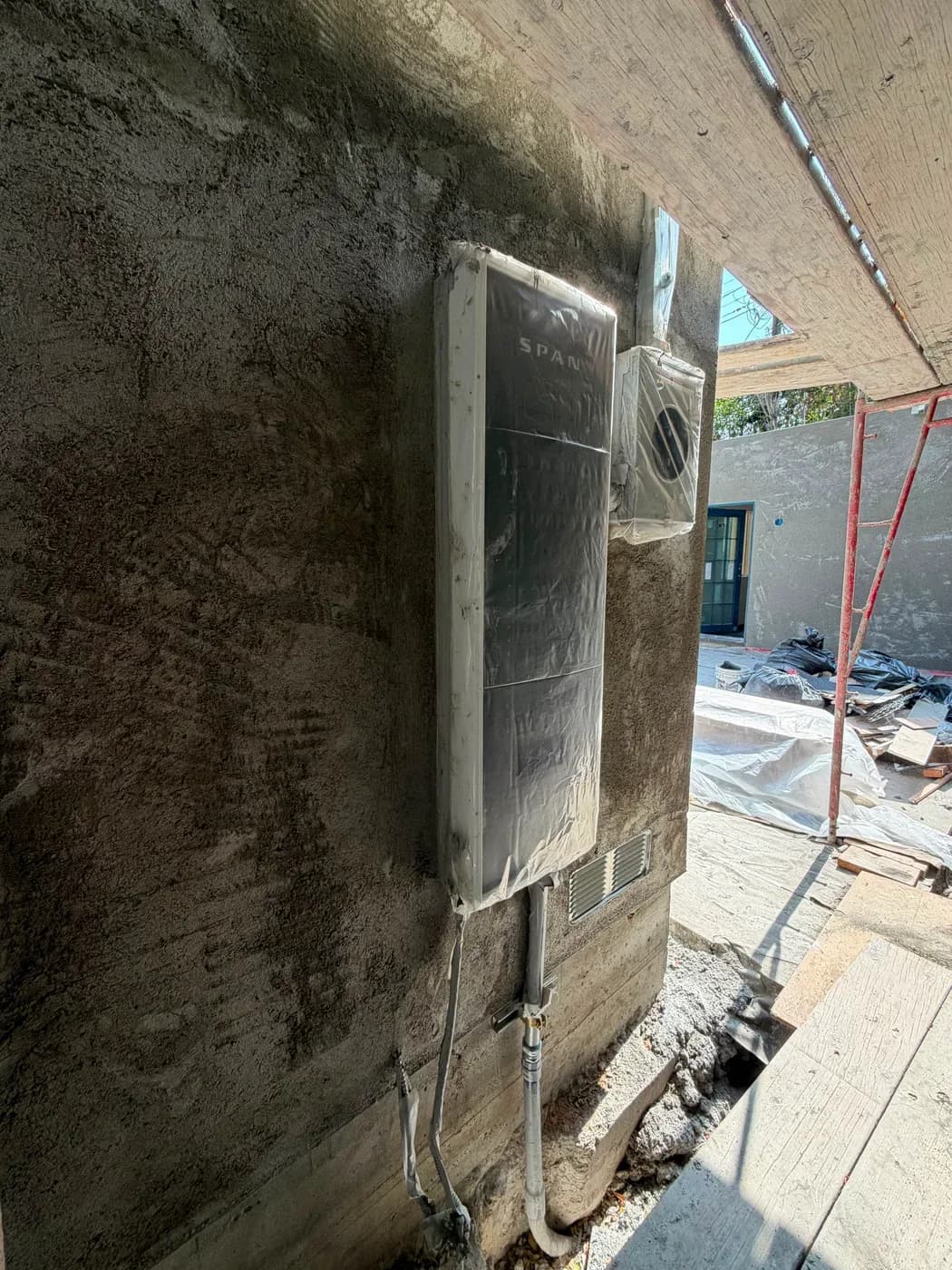 SPAN smart electrical panel installed on exterior wall during construction