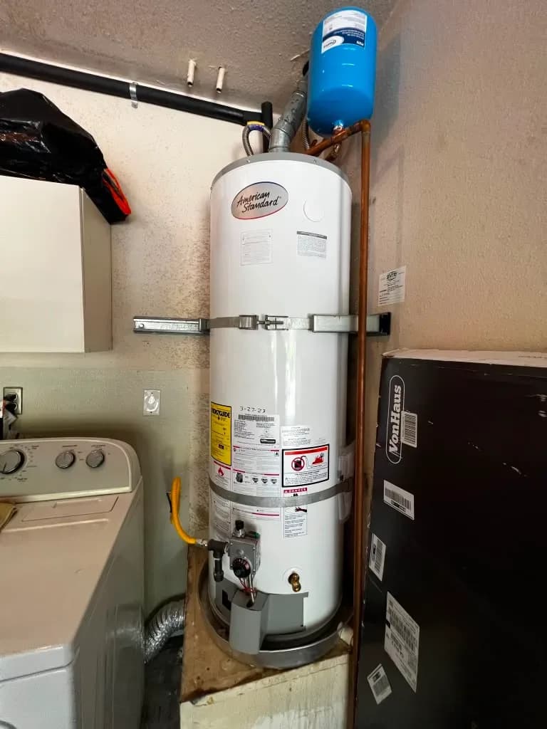 American Standard water heater installed in laundry room with expansion tank